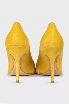 Yellow suede pumps