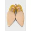 Yellow suede pumps