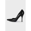 Black leather embossed pumps