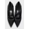 Black leather embossed pumps