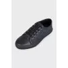 Black leather sneakers with textile inserts