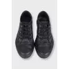 Black leather sneakers with textile inserts