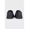 Black leather sneakers with textile inserts