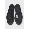 Black leather sneakers with textile inserts