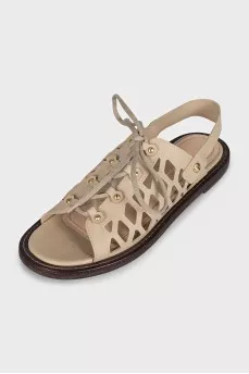 Leather sandals with an openwork pattern