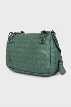 Leather bag with a chain and braided pattern