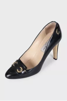 Black leather shoes with gold decor
