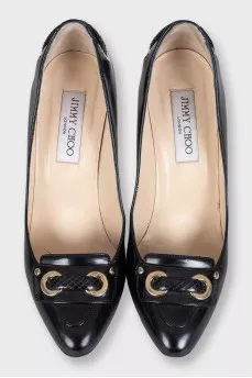 Black leather shoes with gold decor