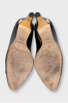 Black leather shoes with gold decor