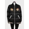 Insulated bomber jacket decorated with embroidery
