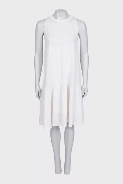 A loose-fitting knit dress decorated with sequins