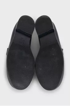 Black leather loafers with logo