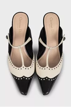 Beige leather mules decorated with perforations