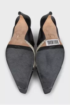 Beige leather mules decorated with perforations