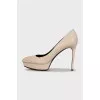 Beige high-heeled pumps