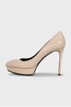 Beige high-heeled pumps
