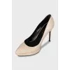 Beige high-heeled pumps