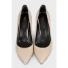 Beige high-heeled pumps