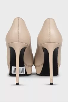 Beige high-heeled pumps