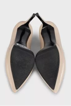 Beige high-heeled pumps