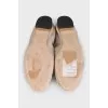 Beige ballet flats decorated with a flower