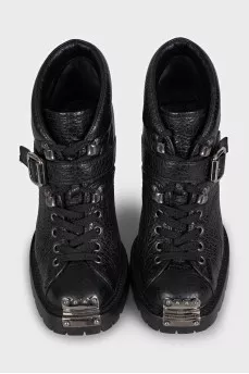 Black ankle boots with toe hardware