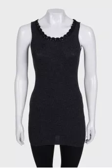 A tight-fitting black tank top with lace trim