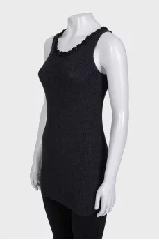 A tight-fitting black tank top with lace trim