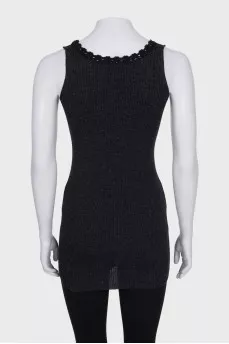 A tight-fitting black tank top with lace trim