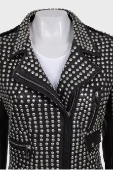 The leather jacket is decorated with rivets