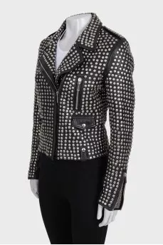 The leather jacket is decorated with rivets