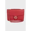 Red leather bag with gold logo