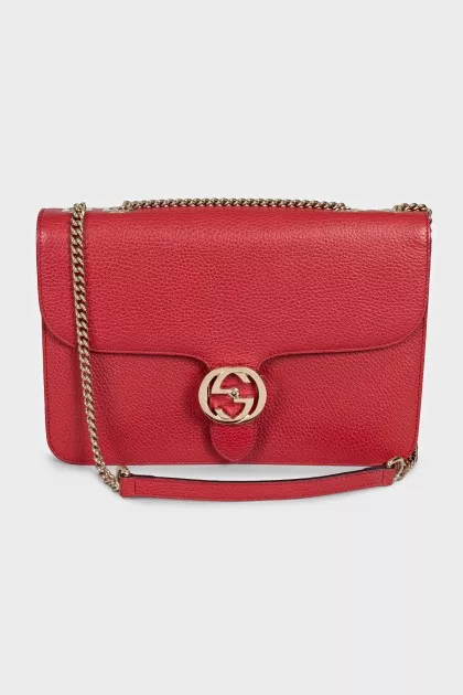 Red leather bag with gold logo
