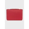 Red leather bag with gold logo