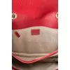 Red leather bag with gold logo