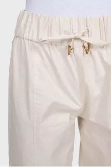 Beige straight-leg trousers with elastic waistband