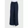 A suit of straight trousers and a shirt