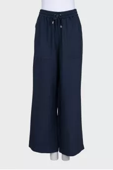 A suit of straight trousers and a shirt