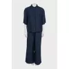 A suit of straight trousers and a shirt