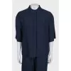 A suit of straight trousers and a shirt