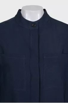 A suit of straight trousers and a shirt