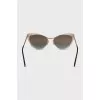 Cat eye sunglasses with gold lenses