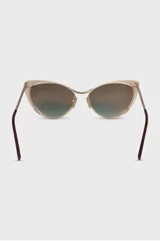 Cat eye sunglasses with gold lenses