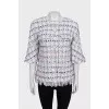 Straight jacket decorated with fringe