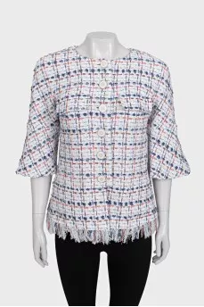 Straight jacket decorated with fringe