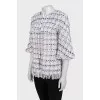 Straight jacket decorated with fringe
