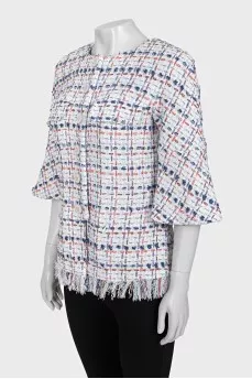 Straight jacket decorated with fringe