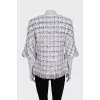 Straight jacket decorated with fringe