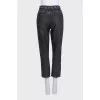 Cropped jeans with a rhinestone-embellished belt