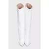 White leather boots with pointed toes